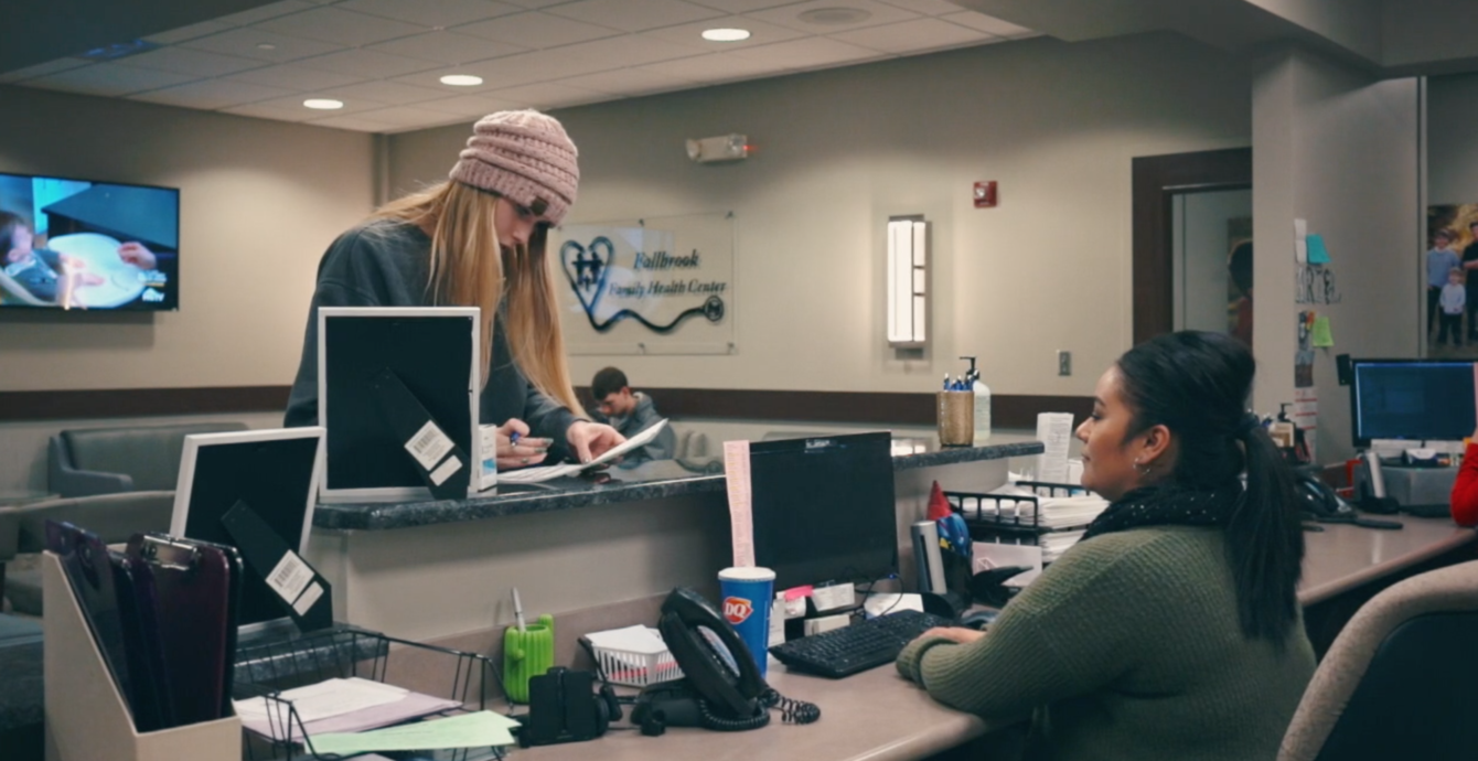 Patient checking in at front desk